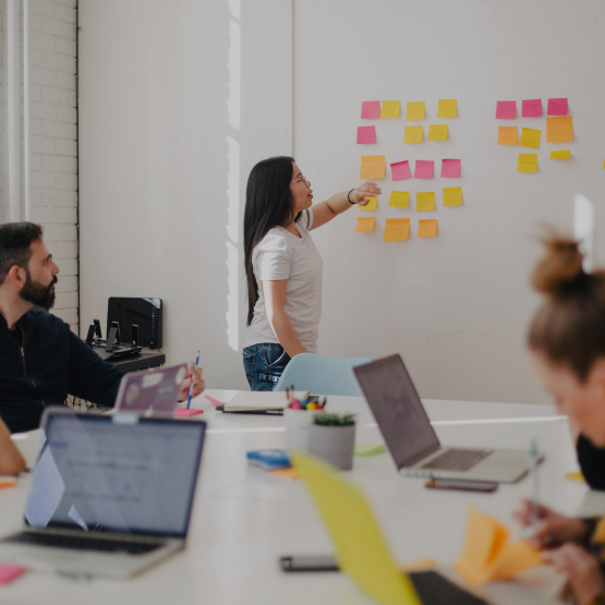 Photo of a woman presenting an advertising campaign brief.
